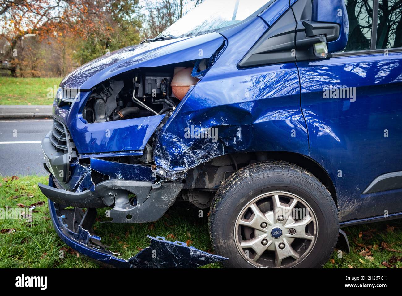 Blue Transit van wrecked on Chislehurst Common Stock Photo
