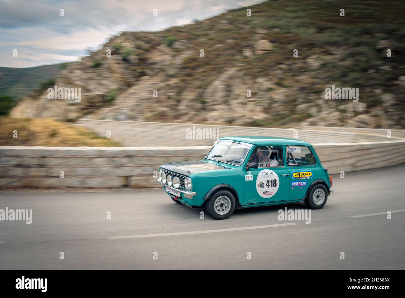 Occhiatana, Corsica, France - 7th October 2021: Antoine Bour and Charles Van Wonterghem compete in their Morris Austin Mini 1275 GT in the 2021 Tour d Stock Photo