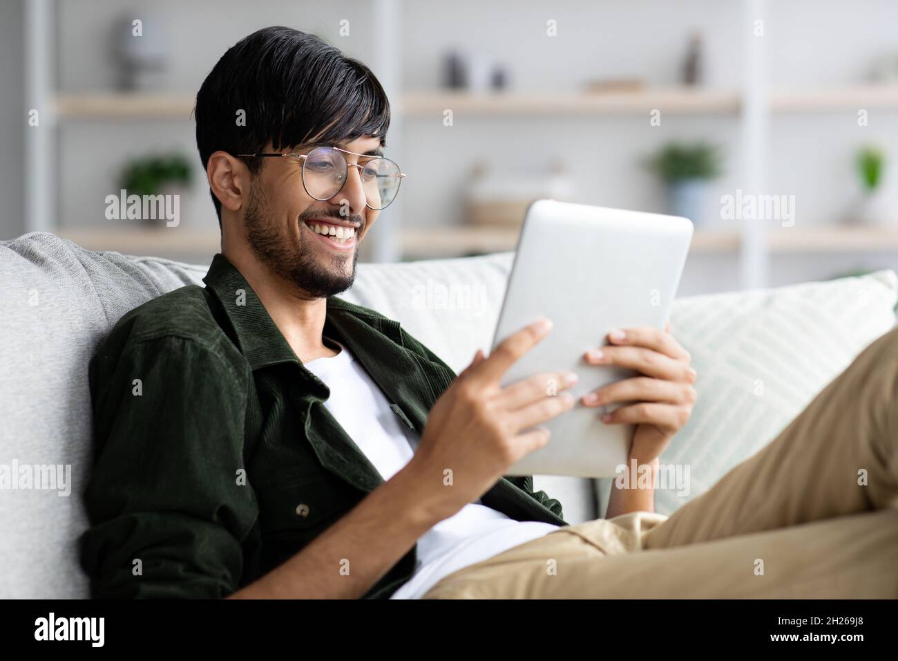 Cheerful relaxed young arabic hi-res stock photography and images - Alamy