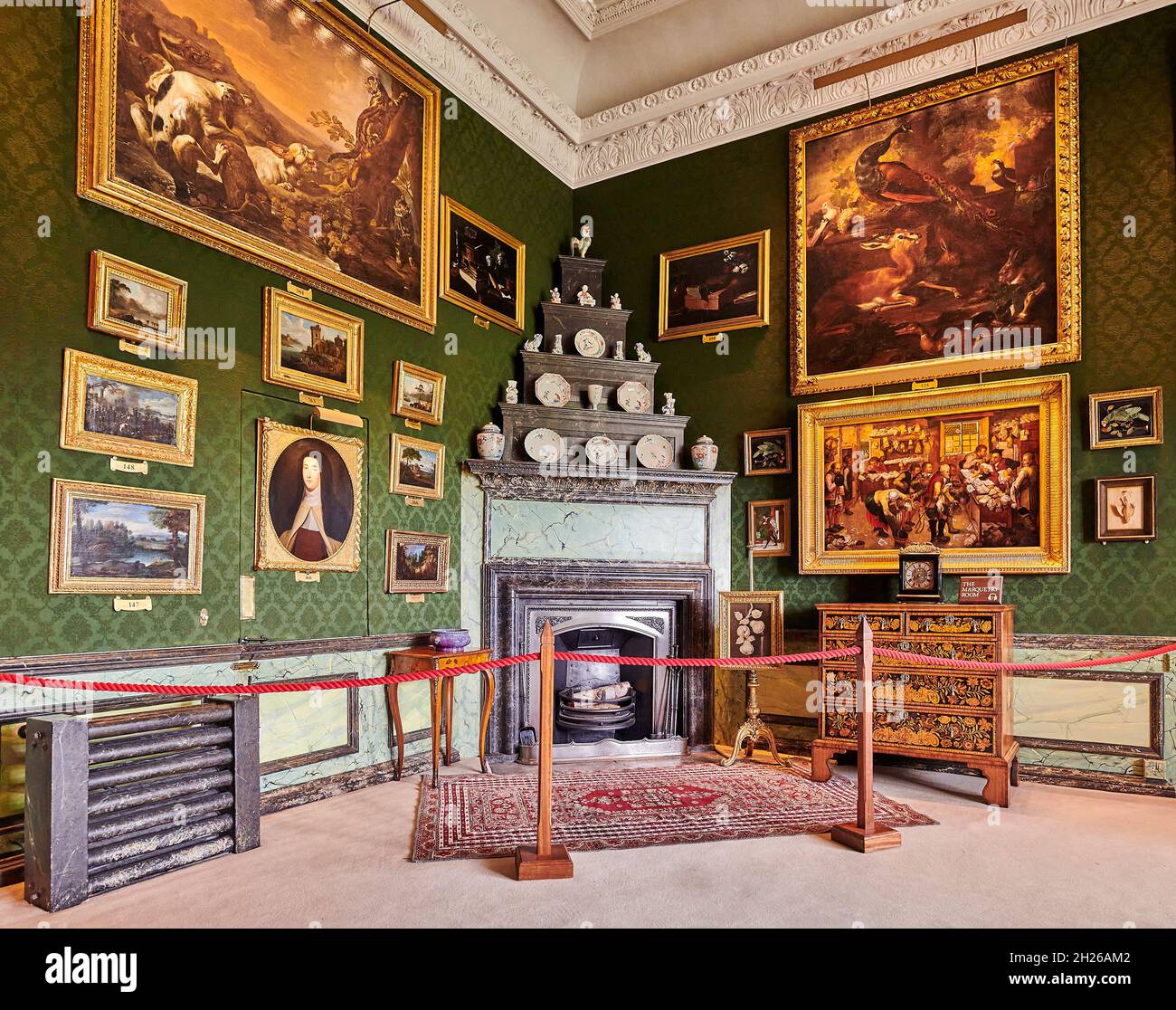 Fireplace in the marquetry room at Burghley House, an elizabethan mansion built by William Cecil, Lord Burghley, at Stamford in 16 century England. Stock Photo