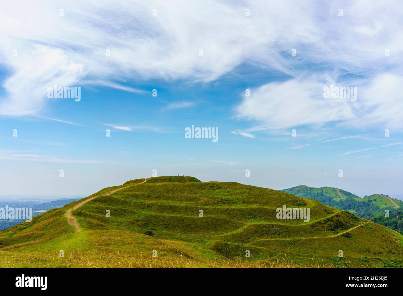 A small group of people standing on the ancient Roman hillfort of British Camp in Great Malvern, Worcestershire, UK Stock Photo
