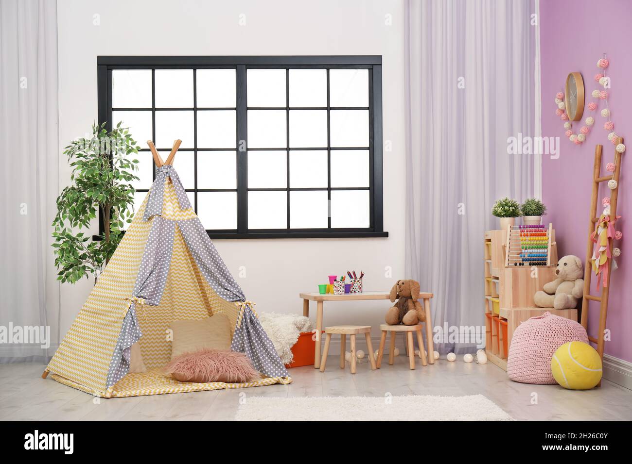 Modern nursery room interior with play tent for kids Stock Photo - Alamy