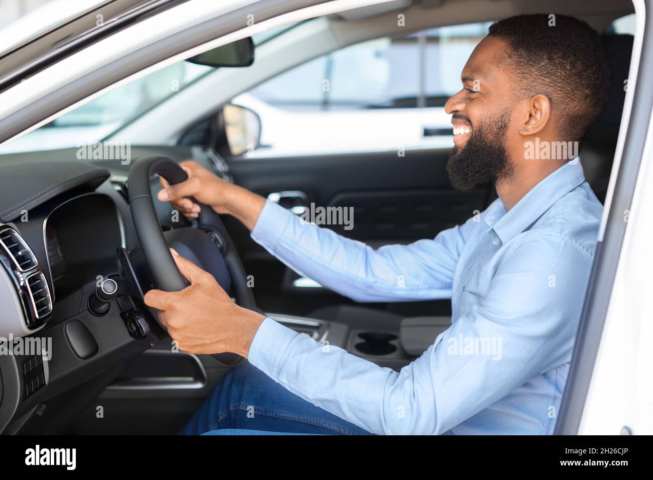 Man sitting at wheel of car hi-res stock photography and images - Alamy