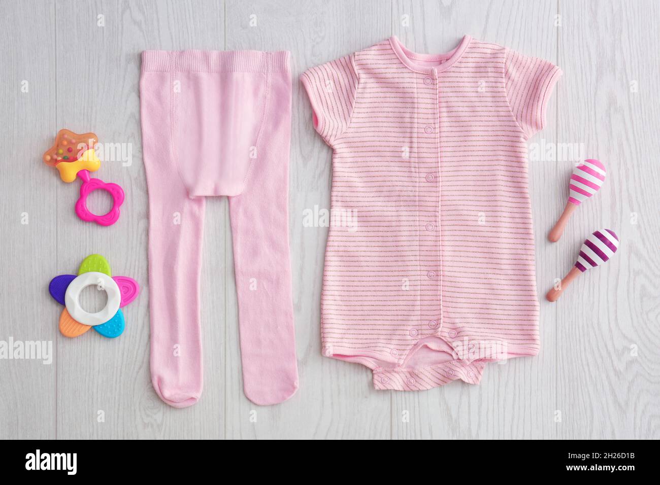 Flat lay composition with fashionable children's clothes on wooden ...