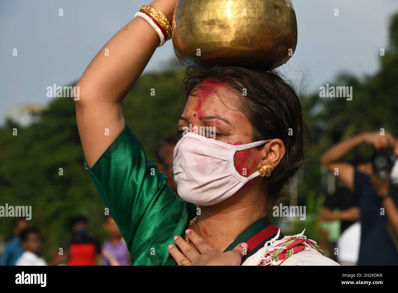 Durga idol immersion ceremony after the end of Durga Puja festival at the riverbank of the Ganges amid 2nd year of Covid-19 pandemic. The worship of G Stock Photo