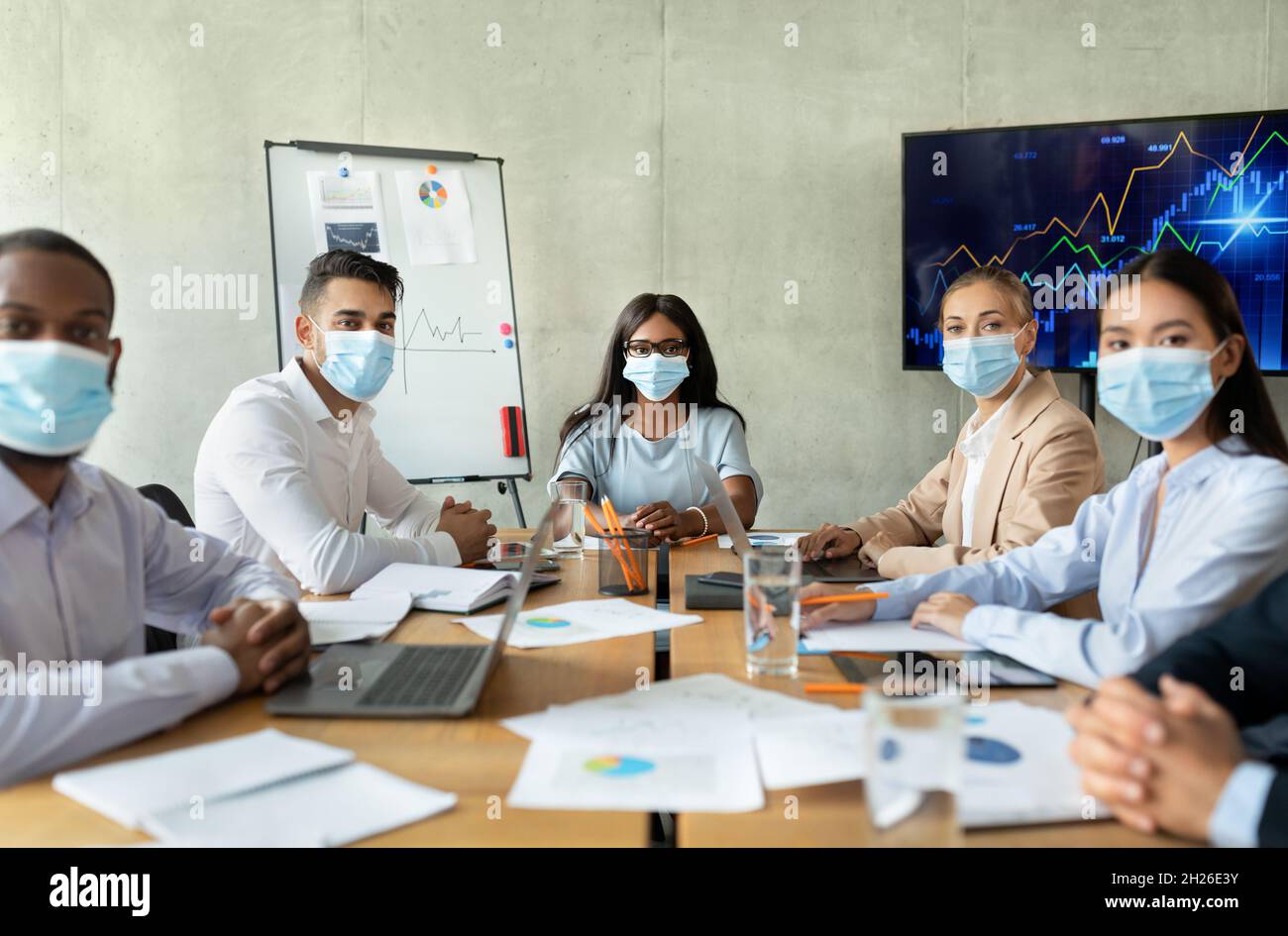 Safety At Work. Business People In Masks Having Corporate Meeting In ...