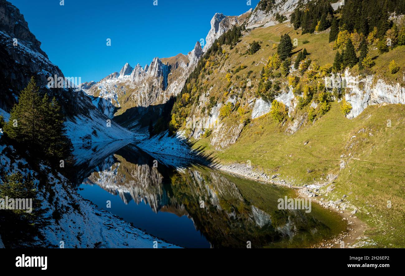 Reflection of the mountains in the Faelensee from the mountain inn Bollenwees Stock Photo