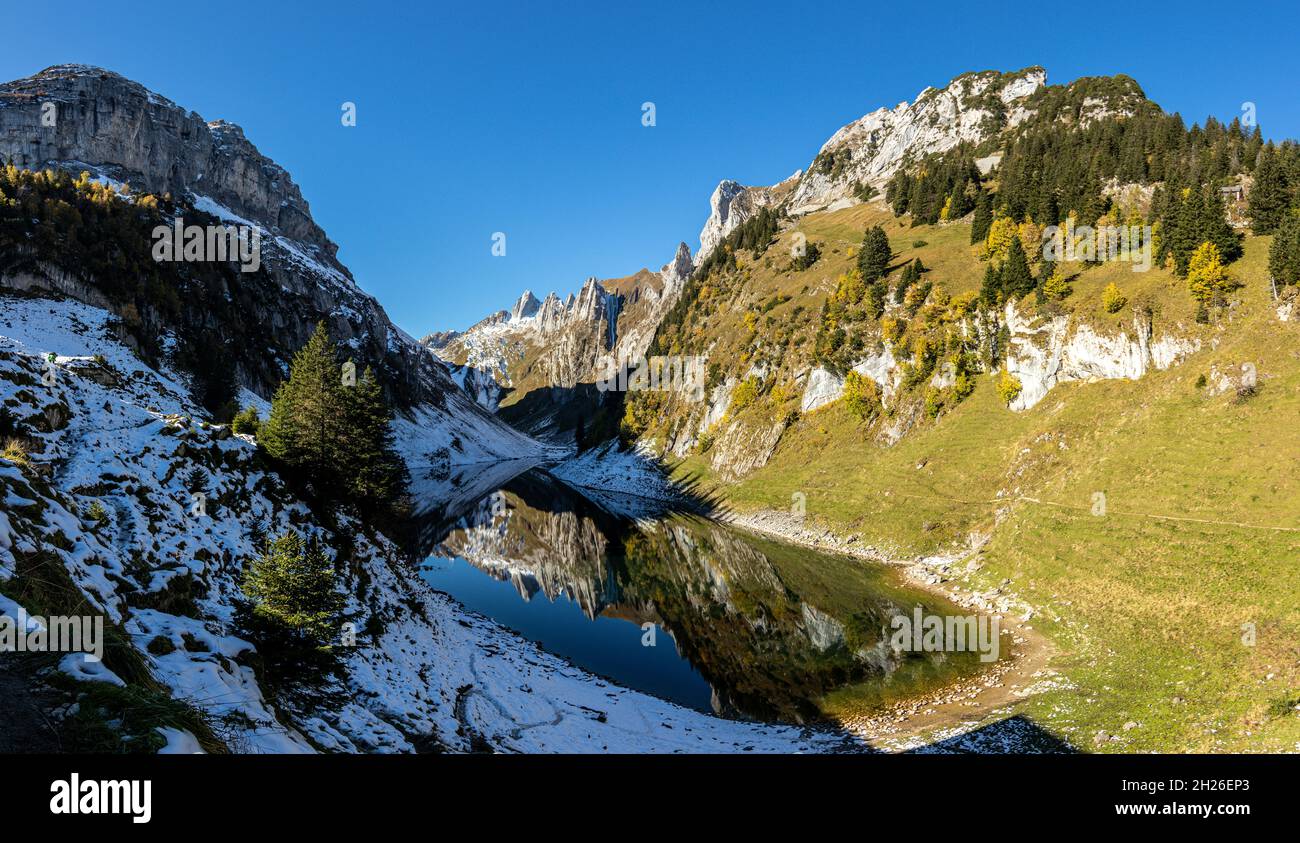 Reflection of the mountains in the Faelensee from the mountain inn Bollenwees Stock Photo