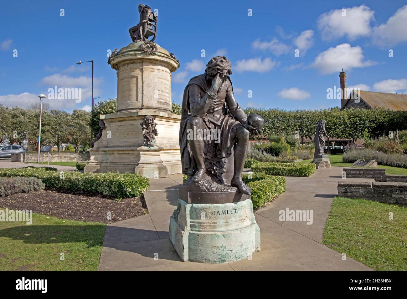 Gower memorial bronze statue of Hamlet with William Shakespeare in background in Bancroft Garden Stratford upon Avon Warwickshire UK Stock Photo