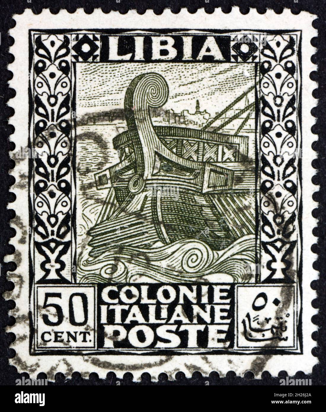 LIBYA - CIRCA 1921: a stamp printed in Libya shows ancient galley leaving Tripoli, circa 1921 Stock Photo