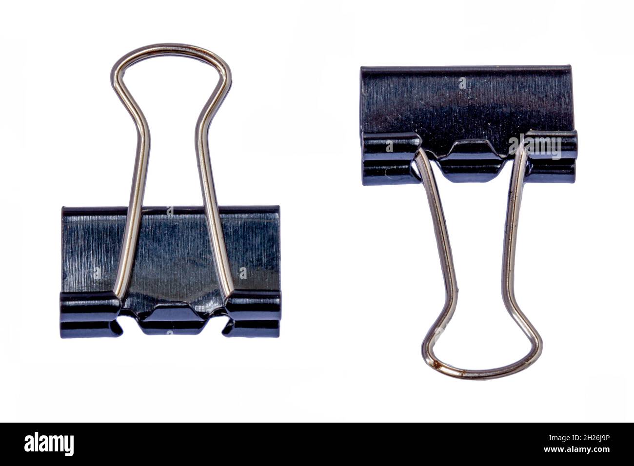 Two black metal paper clips, isolated with a white background, for