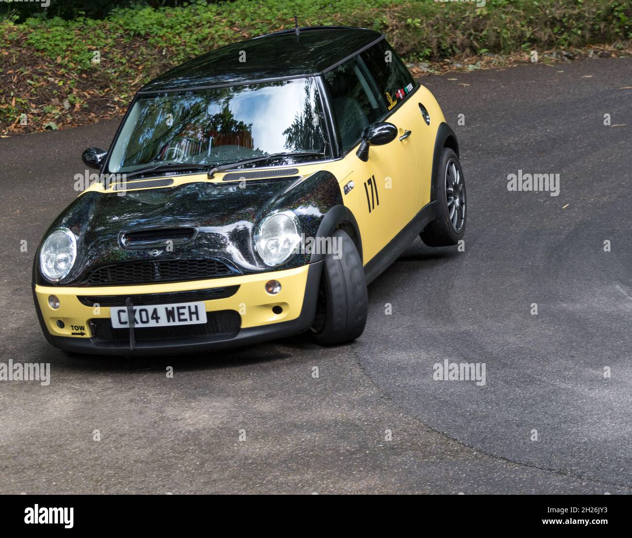Racing Minis at Wiscombe Park Hillclimb in Devon UK. All are specially modified to suit the demands of racing against the clock on a 900yd uphill sprint Stock Photo