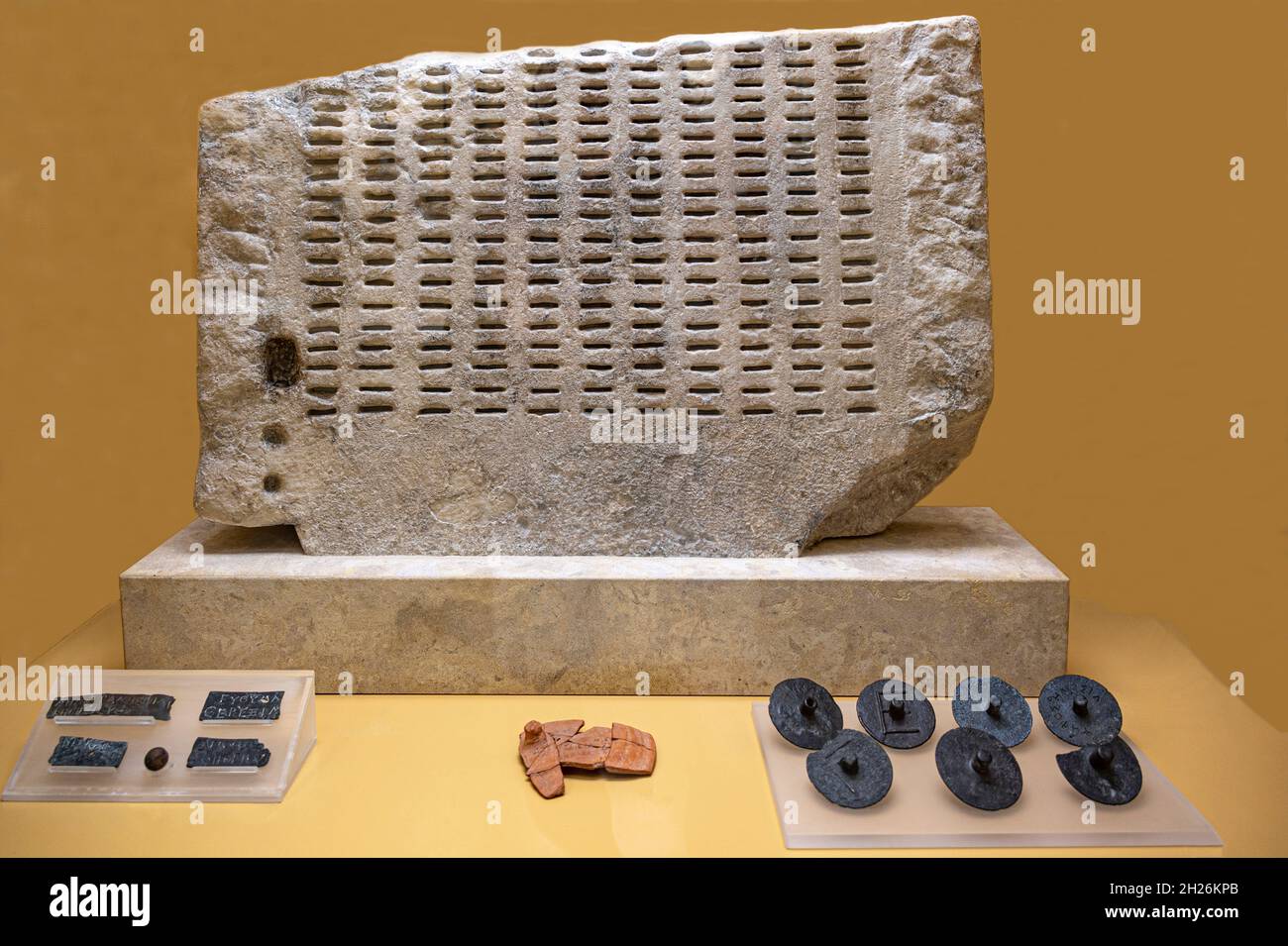 ancient jury selection system from 300 B.C. found at the Museum of the Ancient Agora used for voting to acquit or condemnation by using the bronze bal Stock Photo