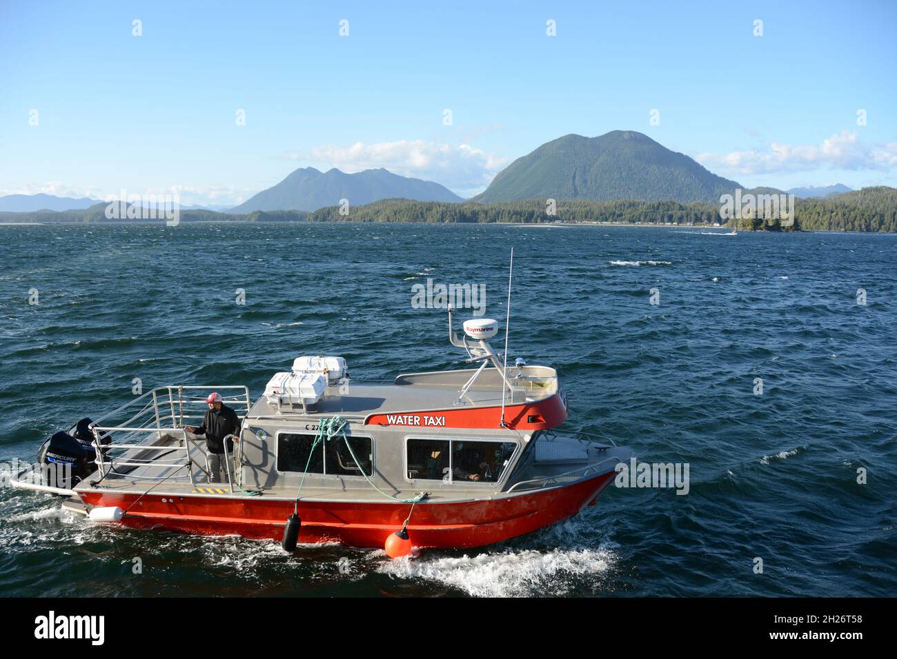 A water taxi off The Nuu-chah-nulth First Nation village of Opitsaht, in Clayoquot Sound, near Tofino, Vancouver Island, British Columbia, Canada. Stock Photo
