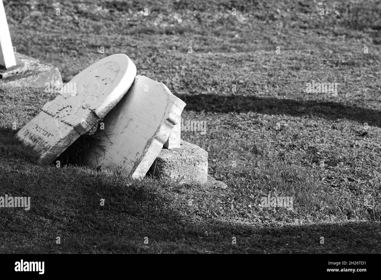 Broken headstones in an old, disused cemetery Stock Photo