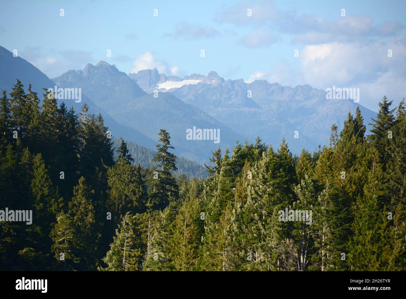 Meares Island and the distant peals of Strathcona Provincial Park, in Clayoquot Sound, near Tofino, Vancouver Island, British Columbia, Canada. Stock Photo