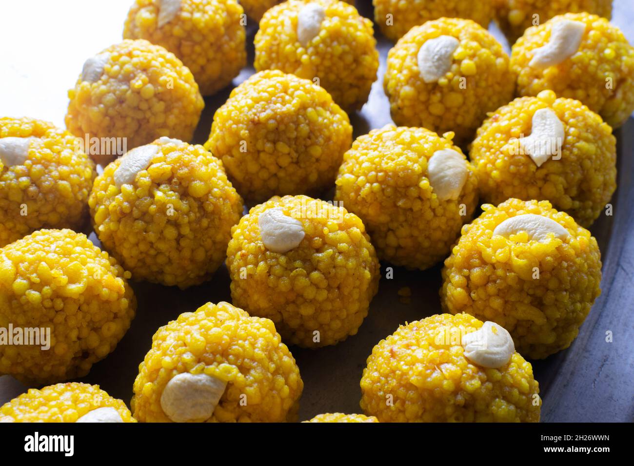 Ladoo sweets with cashew nuts on it garnished. This sweet made during the special occasions and festivals in India. Stock Photo