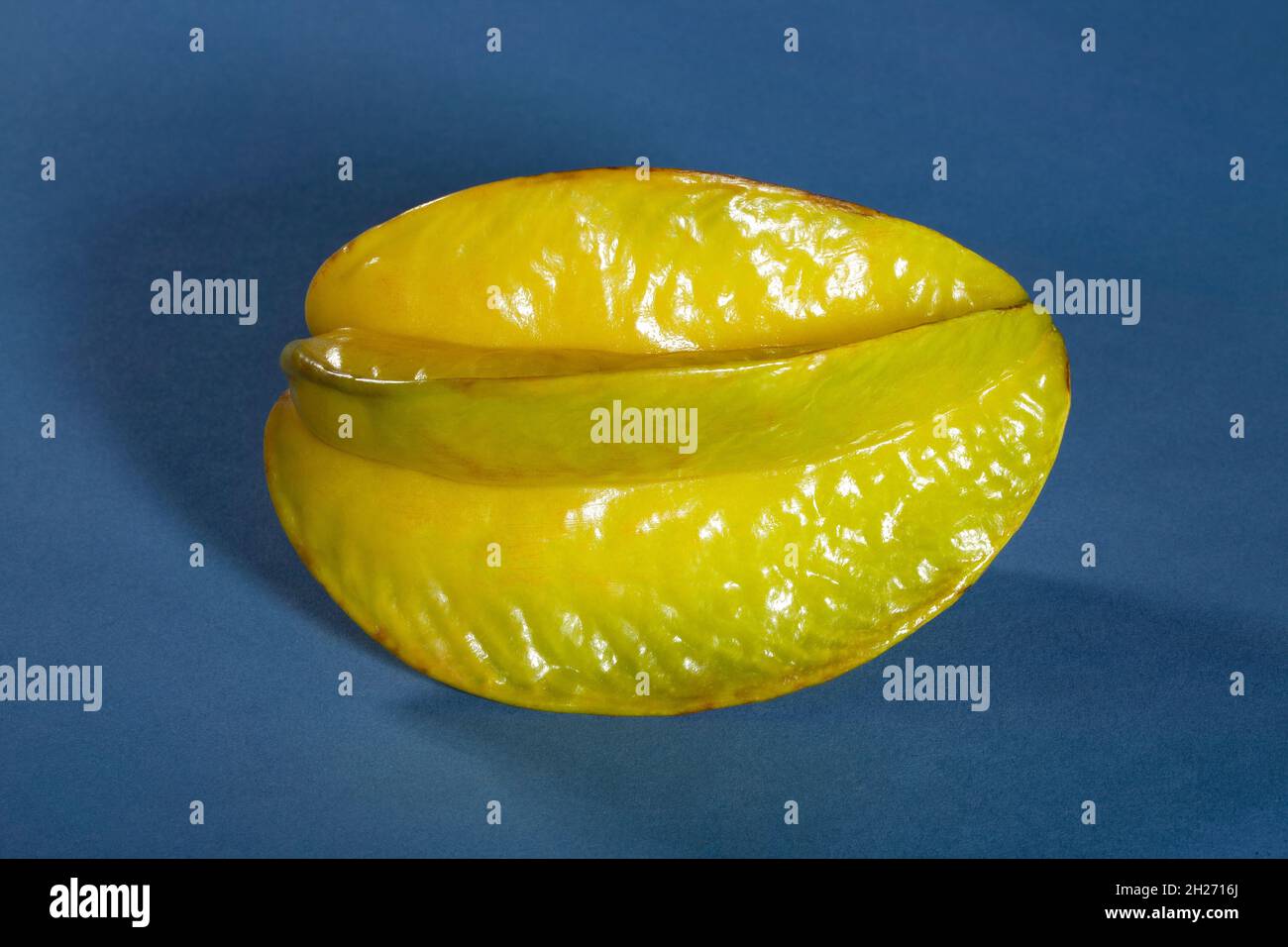 carambola starfruit on blue background Stock Photo