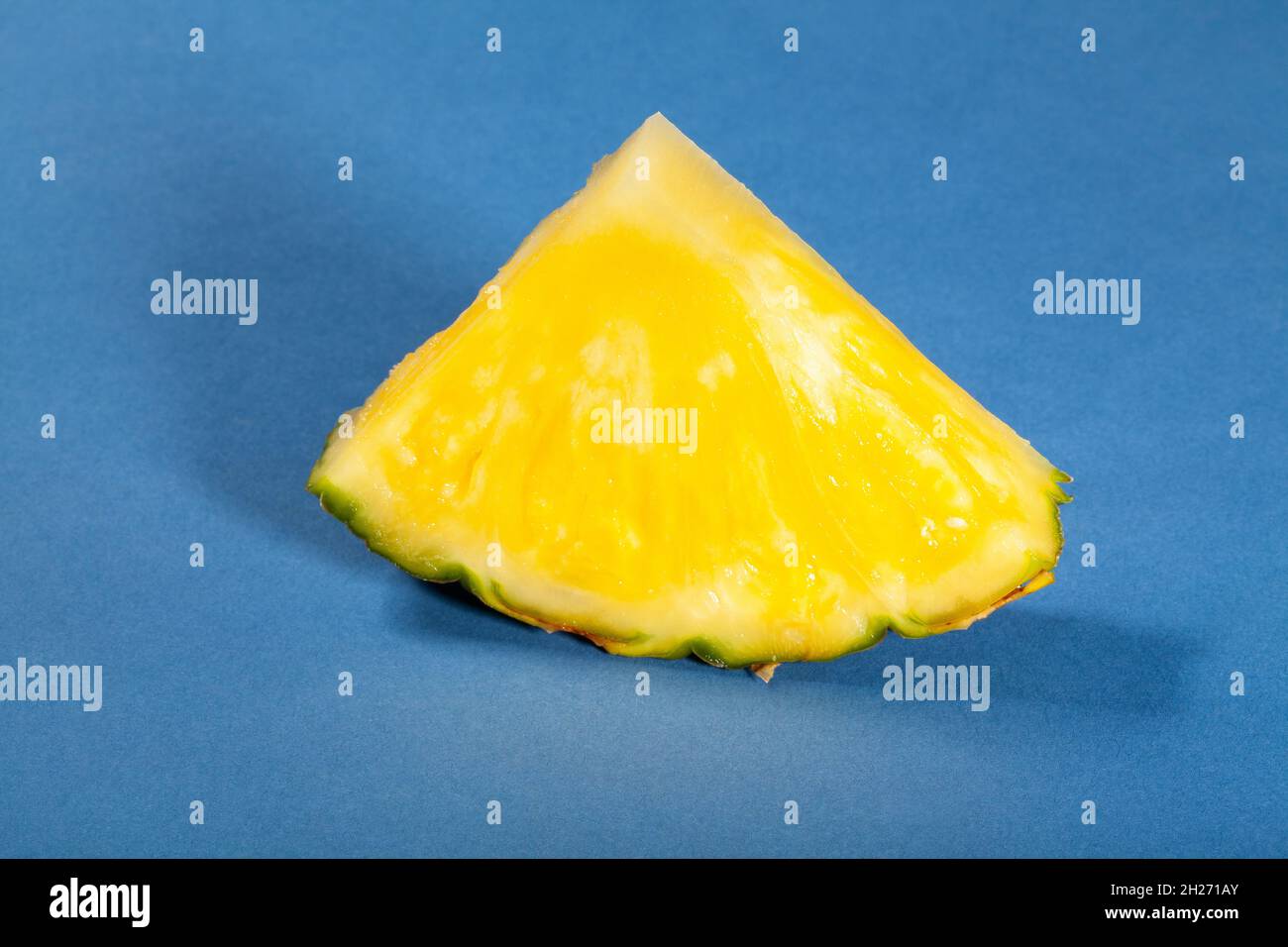 pineapple slice on blue background Stock Photo