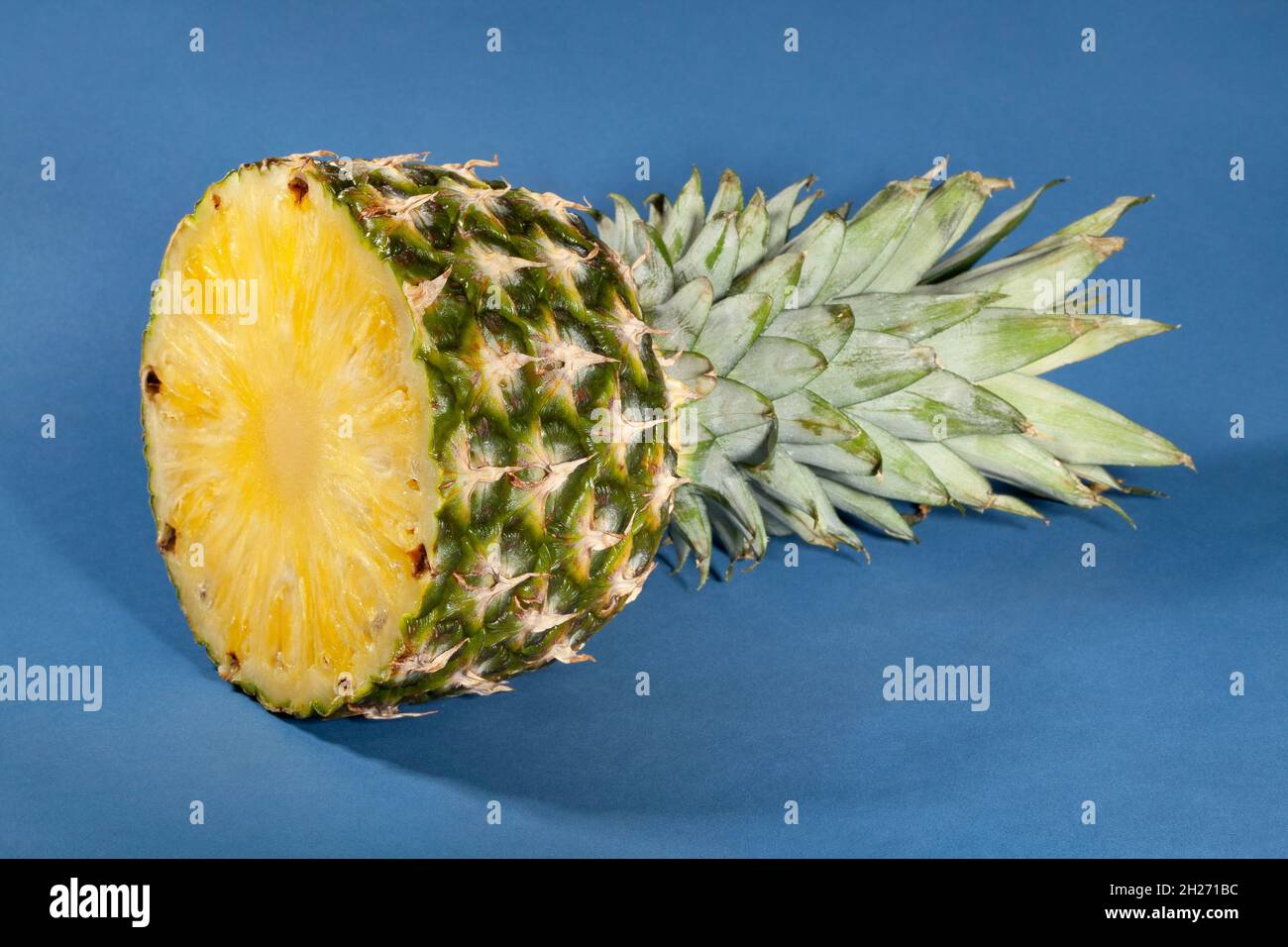 sliced pineapple on blue background Stock Photo