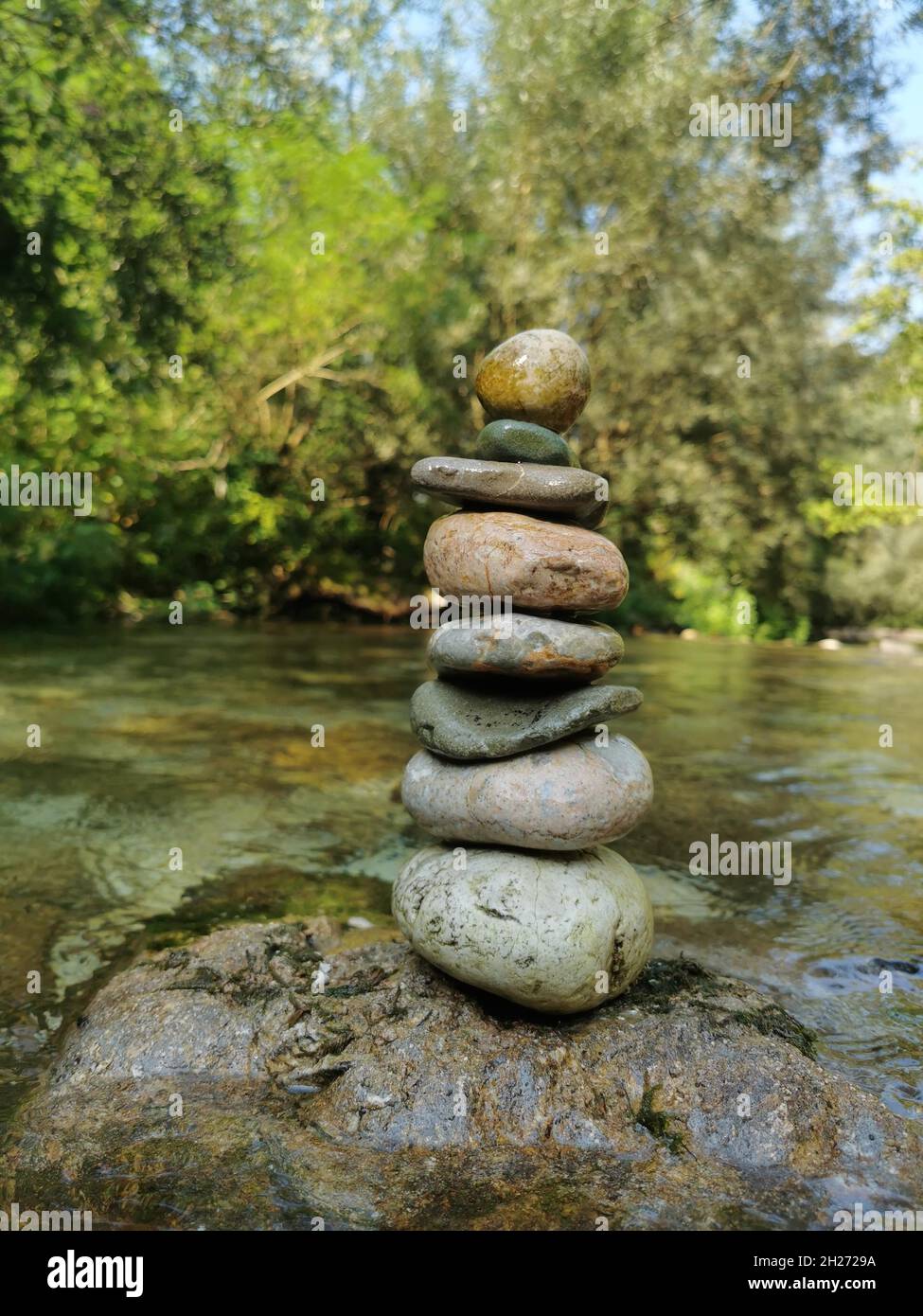 Stoacked Rocks Stacked rocks outdoors with greenery and water hi-res stock photography ...