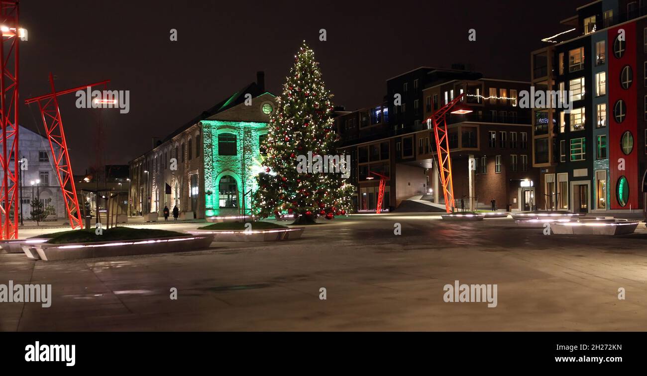 Big Christmas tree in Tallinn city on square in new quarter Noblessner Port. Kalamaja area. Stock Photo