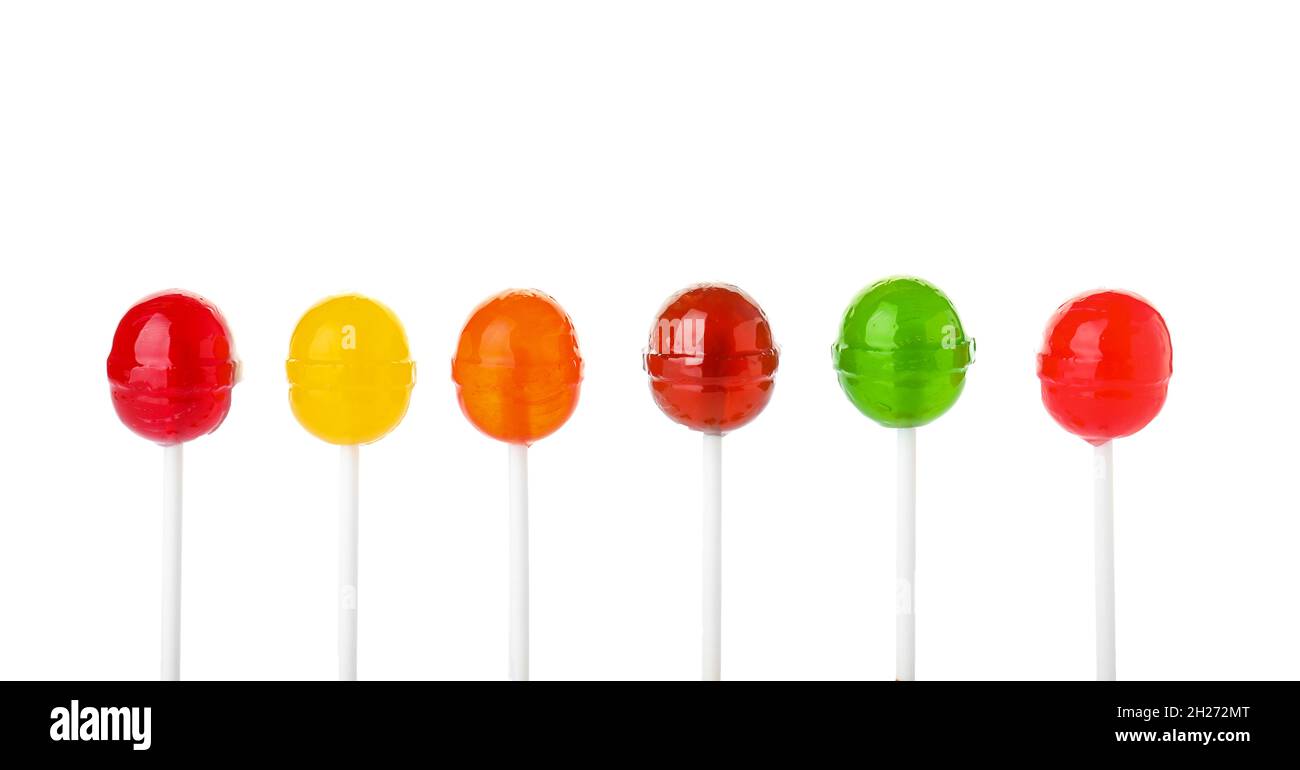 Different tasty colorful candies on white background Stock Photo - Alamy