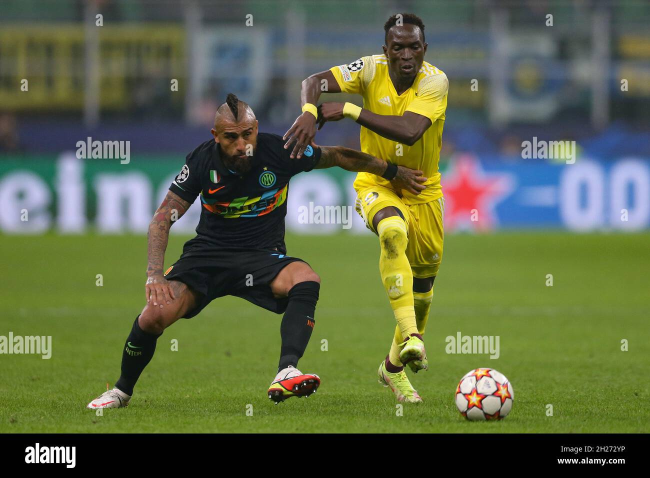 Milan, Italy, 19th October 2021. Arturo Vidal of FC Internazionale tussles with Adama Traore of Sheriff Tiraspol during the UEFA Champions League match at Giuseppe Meazza, Milan. Picture credit should read: Jonathan Moscrop / Sportimage Stock Photo