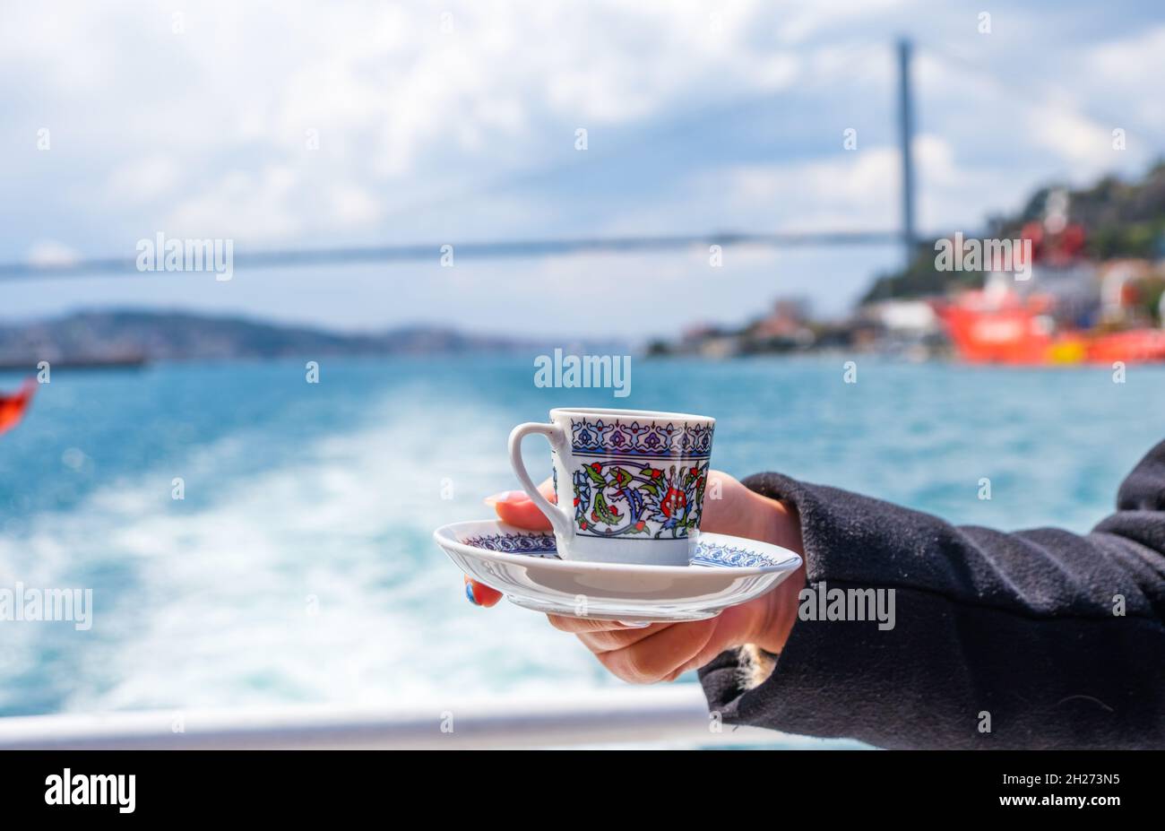 hand with turkish coffee cup in Istanbul. Travel concept Stock Photo