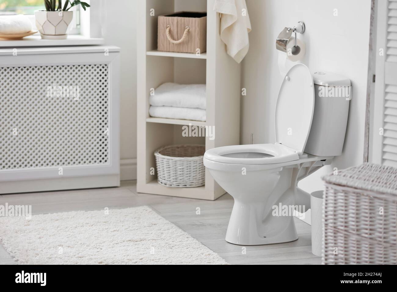 Toilet bowl in modern bathroom interior Stock Photo - Alamy