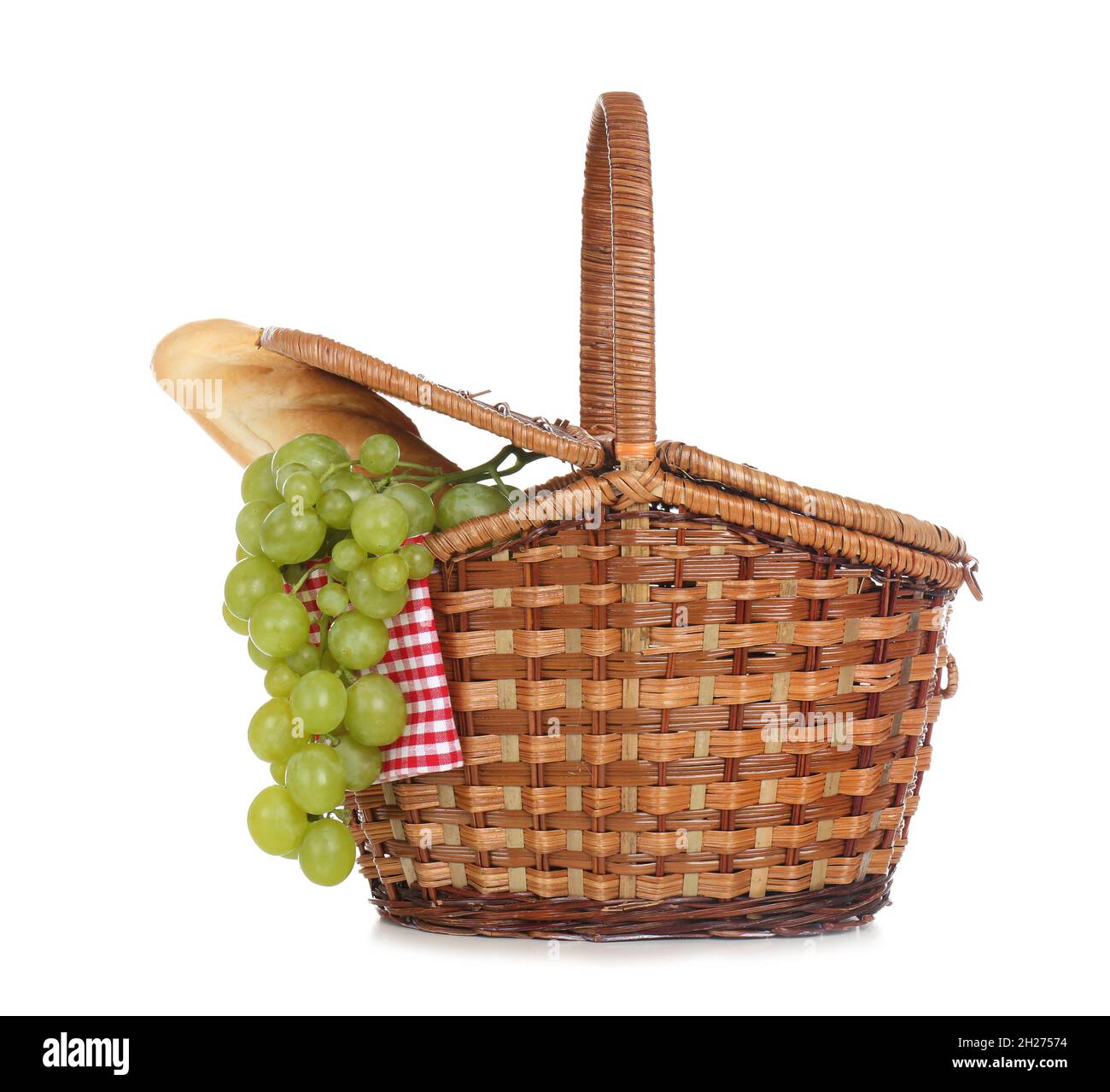 Wicker basket for picnic filled with food on white background Stock ...