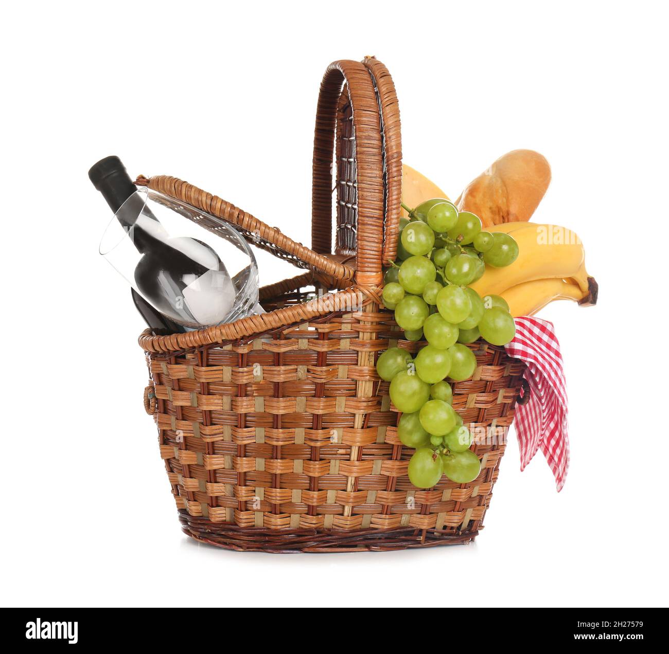 Wicker basket for picnic filled with food on white background Stock ...