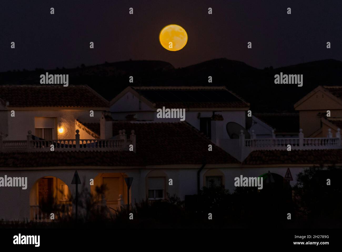 Camposol, Murcia, Spain. 20th Oct, 2021. The full moon named Hunter’s Moon has risen over the Spanish urbanisation of Camposol in the region of Murcia, Spain. The urbanisation is almost entirely populated by British ex-pats Stock Photo