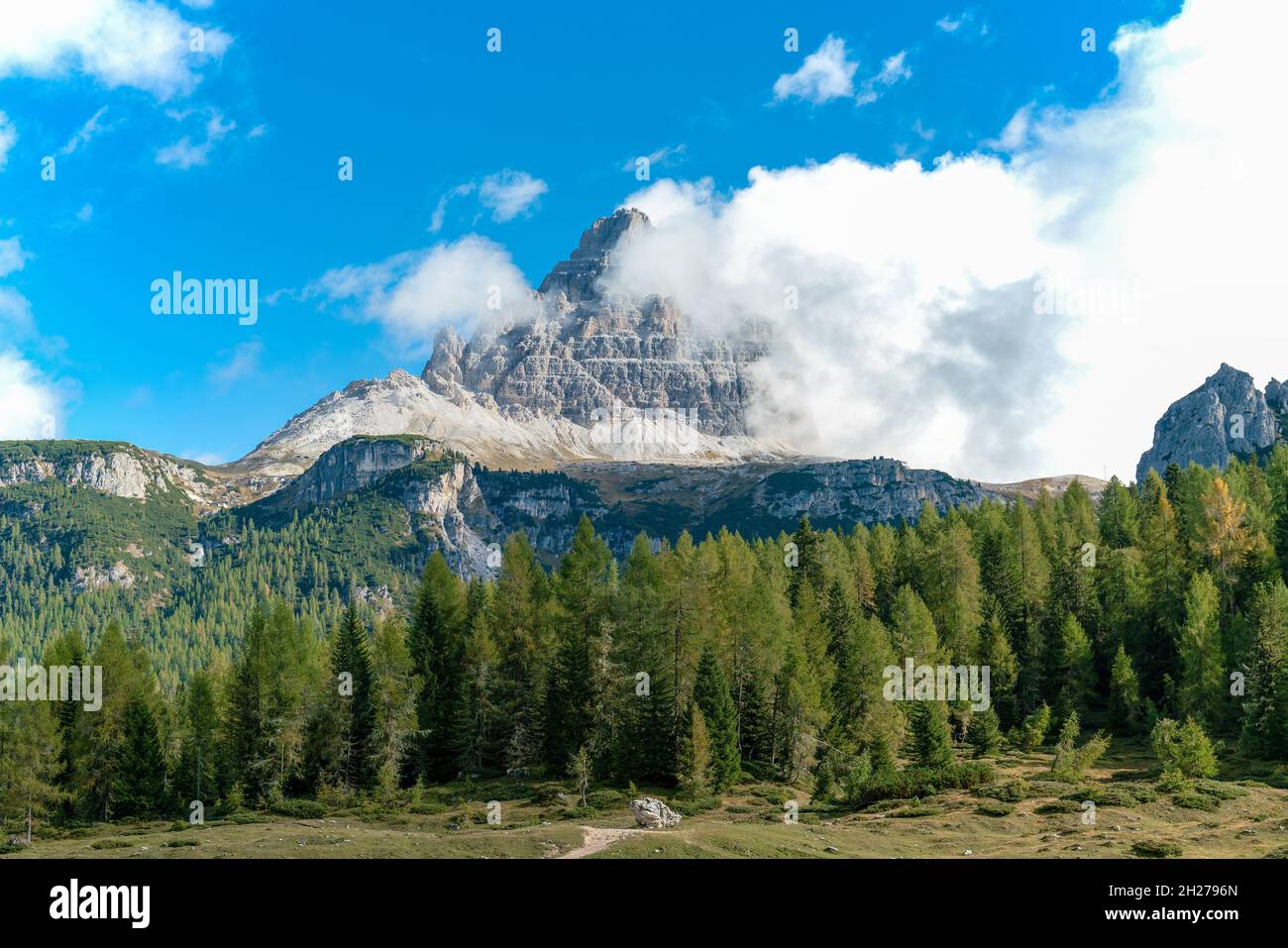 Idyllic landscape at hiking path underneath the famous three peaks mountains in the italian dolomite alps Stock Photo