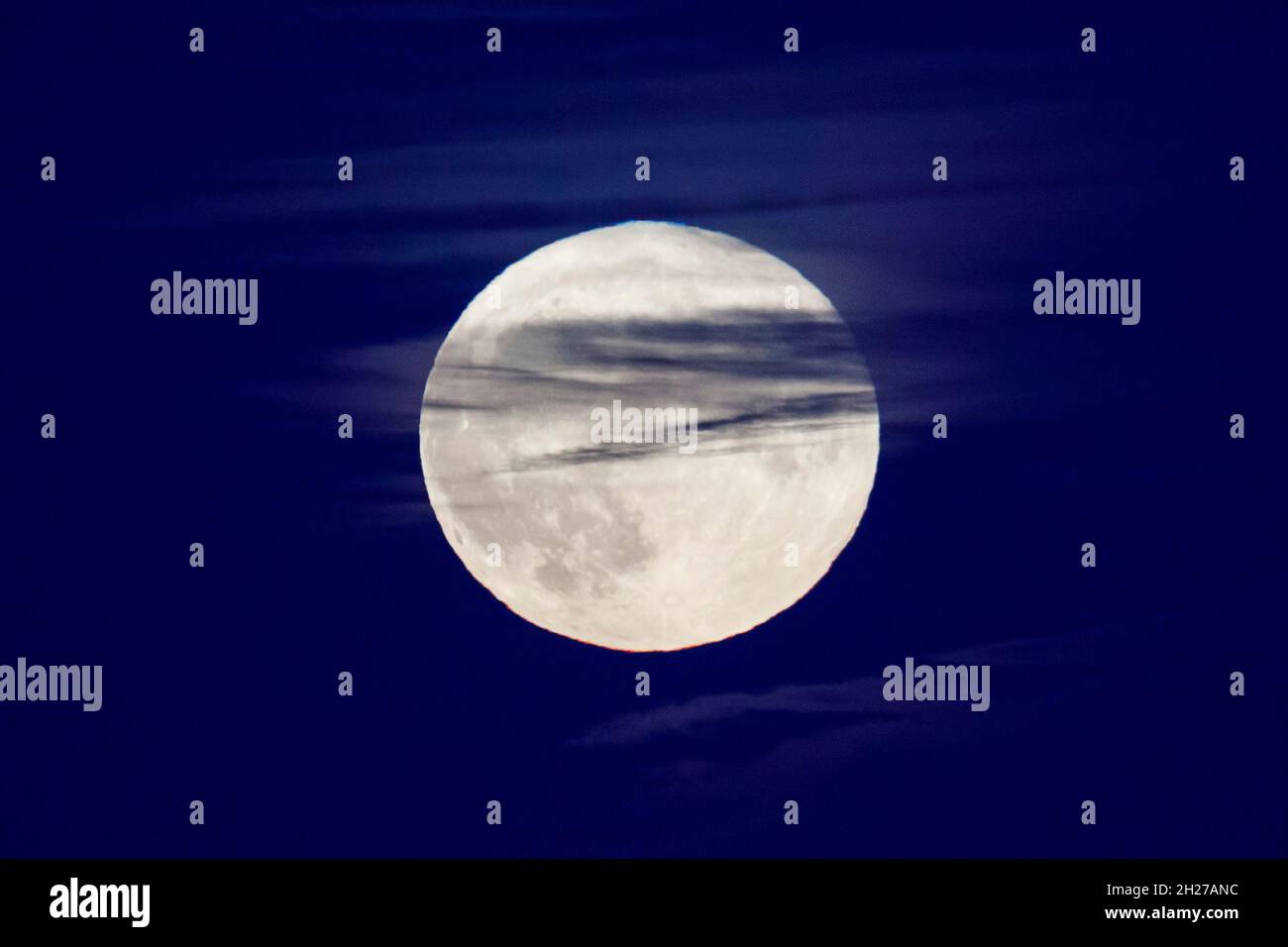 Eastbourne, UK. 20th Oct 2021. Tonights full moon, also known as a Hunters moon, rises over the sea at Eastbourne. Credit: Ed Brown/Alamy Live News Stock Photo