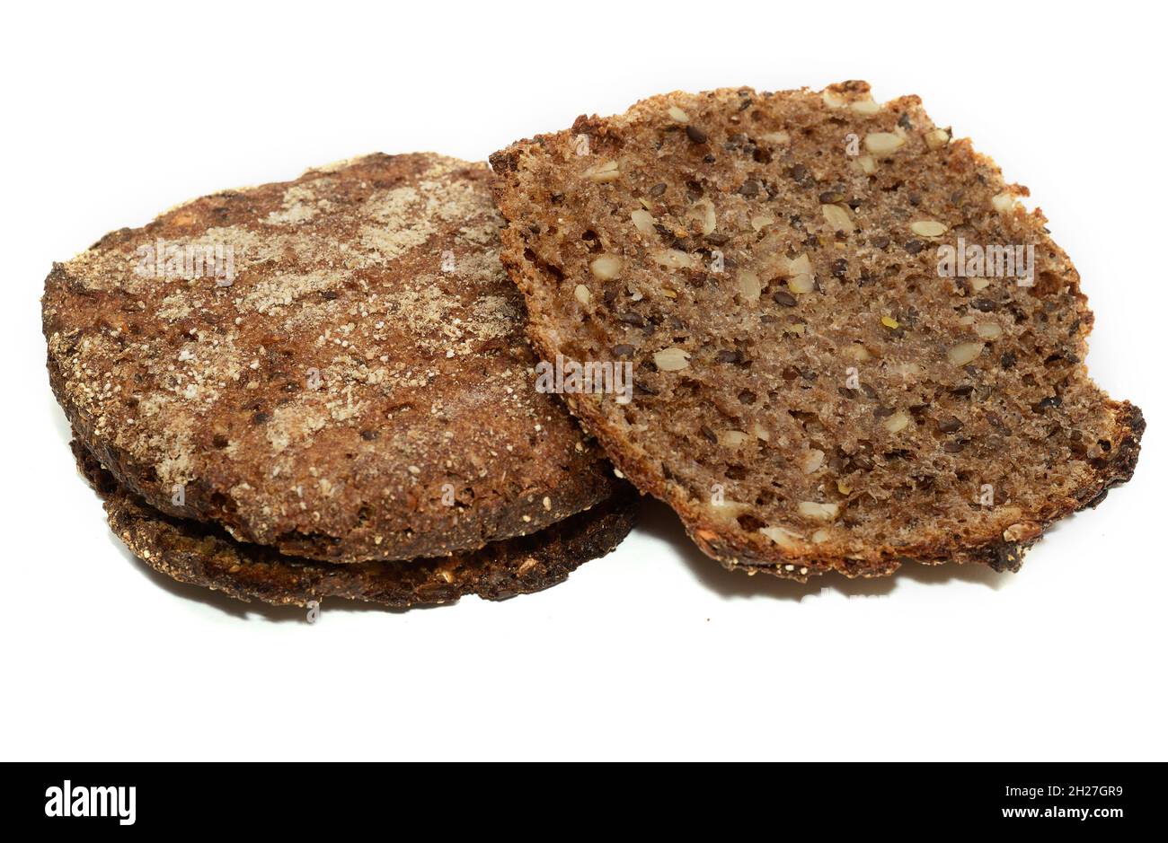 rye bread with sunflower and flax seeds on a white background Stock