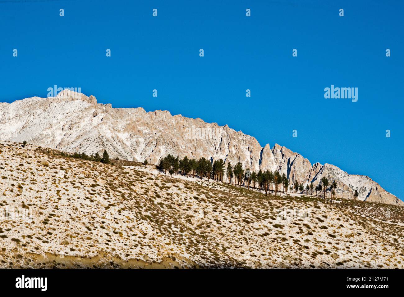 Landscape defining the texture & patterns of Sierra Nevada mountain range in the morning autumn air & rich blue skies= success, permenace, excitemen Stock Photo