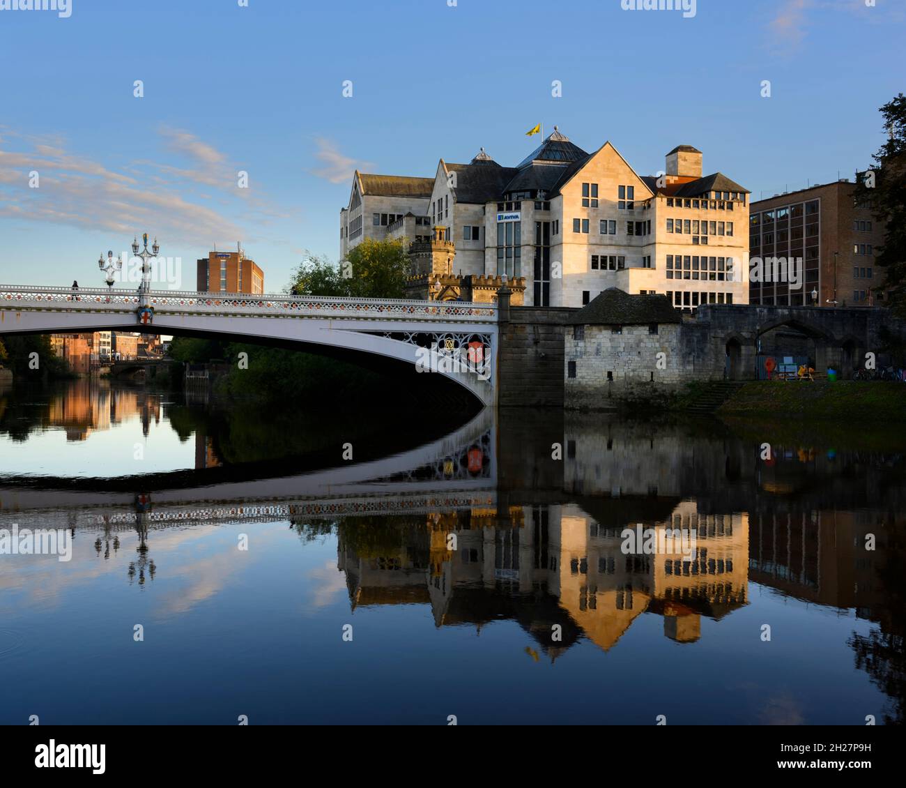 Lendal Bridge & waterfront buildings (Aviva office block) clearly reflected in River Ouse - picturesque York city centre, North Yorkshire, England UK. Stock Photo