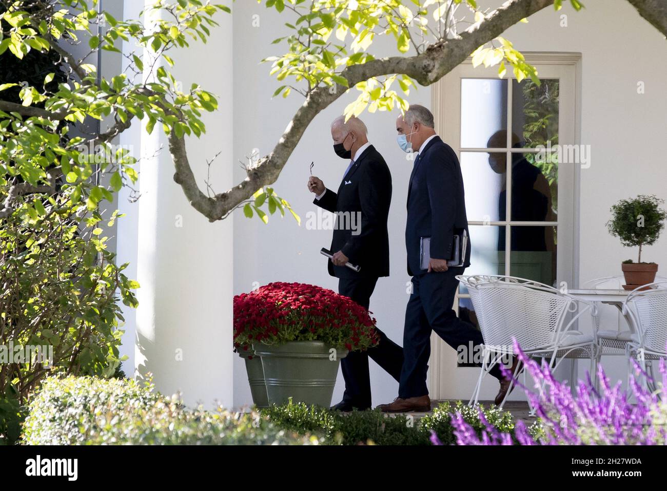 Washington, United States. 20th Oct, 2021. President Joe Biden (L) walks with Democratic Senator from Pennsylvania Bob Casey (R) outside the West Wing to depart the South Lawn of the White House by Marine One, in Washington, DC, on Wednesday, October 20, 2021. Biden travels to Scranton, Pennsylvania, to deliver remarks on his infrastructure plan and 'Build Back Better' agenda. Photo by Michael Reynolds/UPI Credit: UPI/Alamy Live News Stock Photo