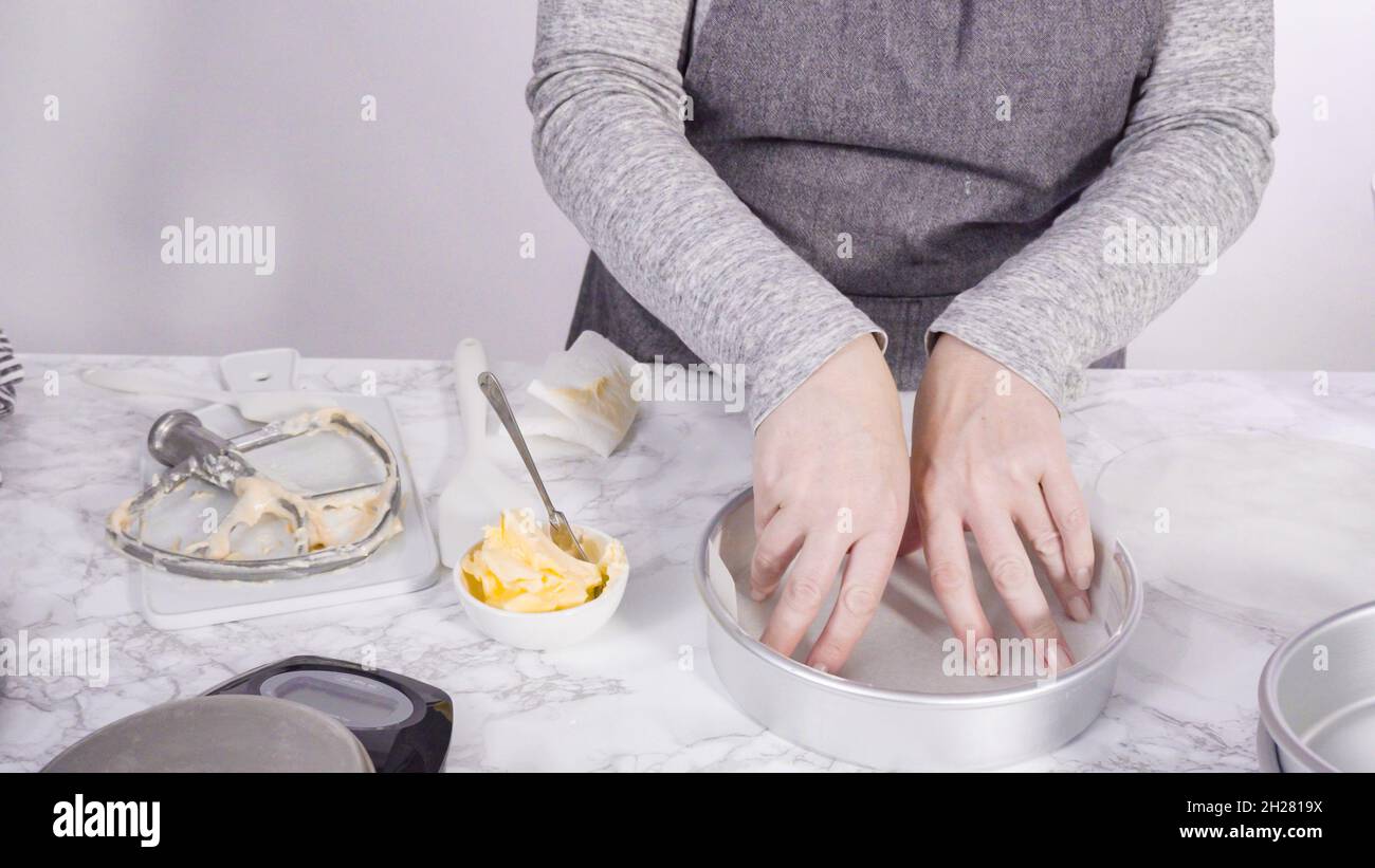 Step by step. Greasing cake pans with butter to bake funfetti cake