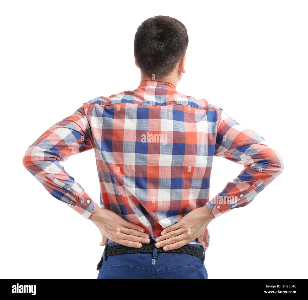 Young man suffering from back pain on white background Stock Photo - Alamy