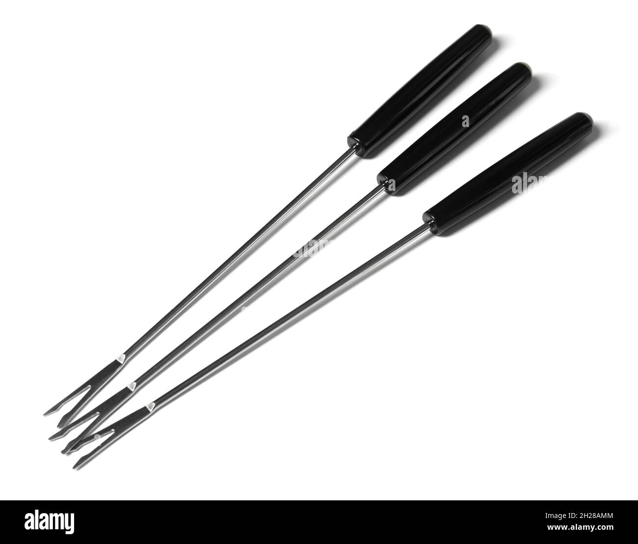 Set of fondue forks on white background. Kitchen equipment Stock Photo