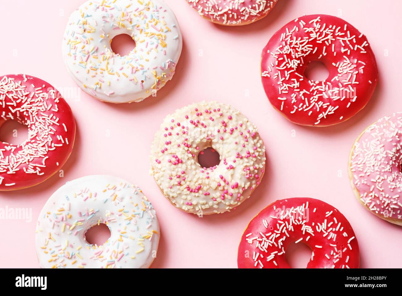 Delicious glazed doughnuts on color background, top view Stock Photo ...