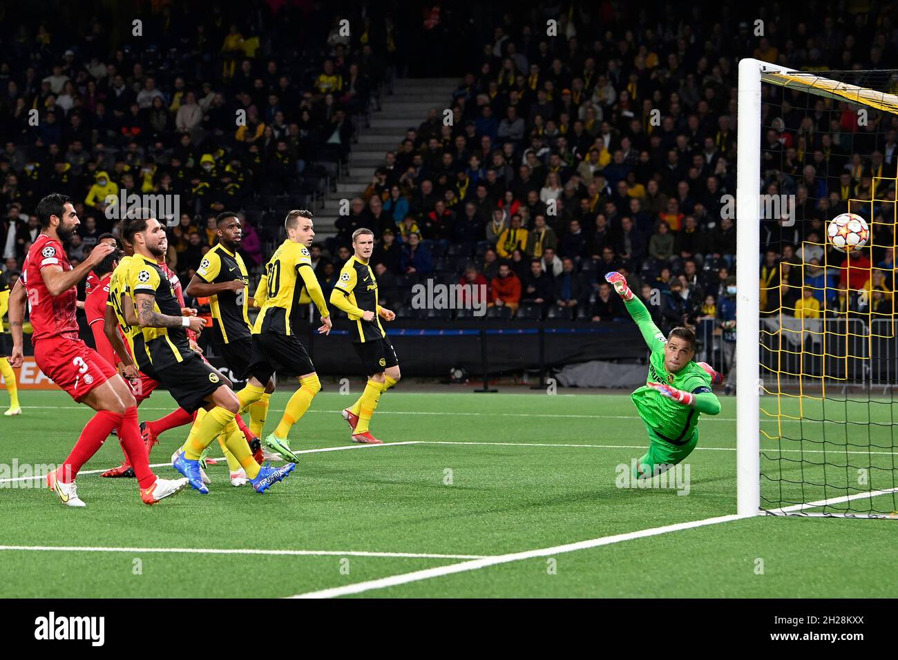 BERN, SWITZERLAND - OCTOBER 20: BSC Young Boys goalkeeper David von  Ballmoos can't stop Gerard Moreno (not in picture) from scoring Villarreals  second goal during the UEFA Champions League group F match