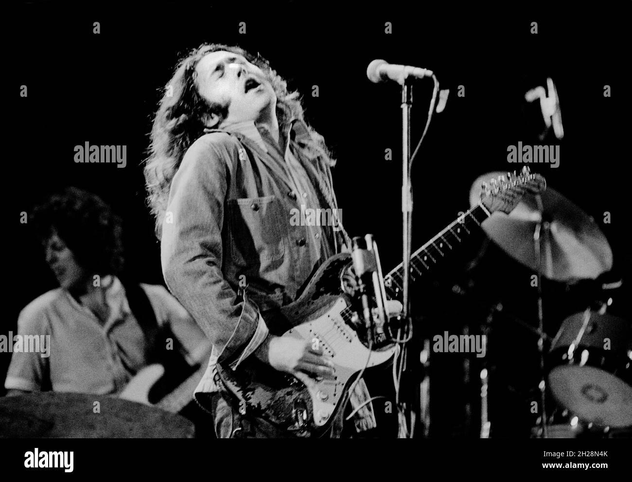 Irish blues/rock guitarist and singer Rory Gallagher at the Lyceum Theatre, London, England in 1977. Stock Photo