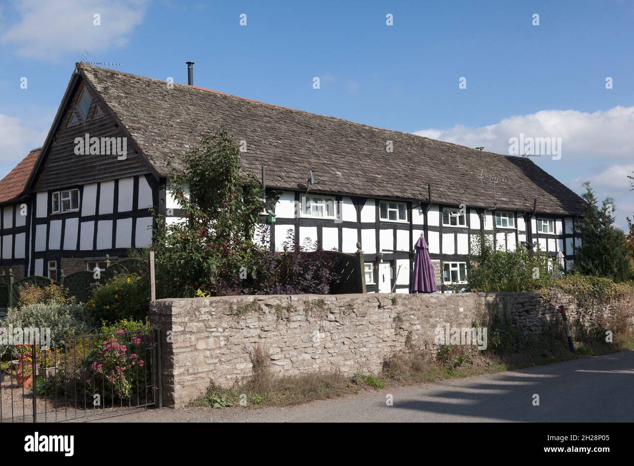 Former 18th century barn in Castle Close converted to dwellings, Eardisley, Herefordshire Stock Photo