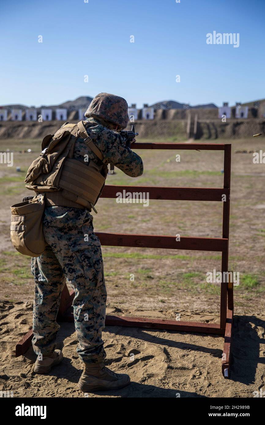 A U.S. Marine engages targets with an M16A4 service rifle during the ...