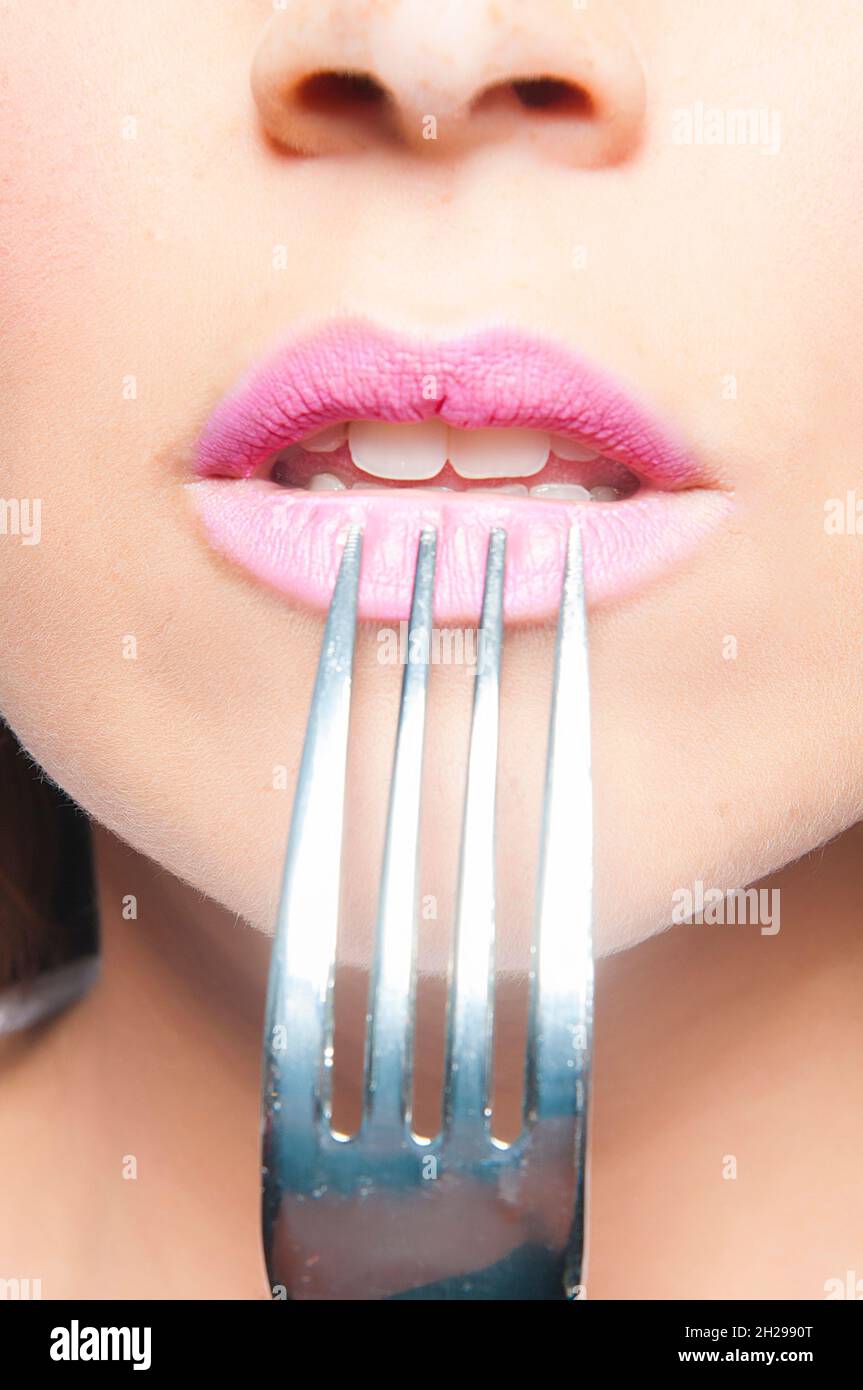 woman's mouth eating with a fork Stock Photo Alamy