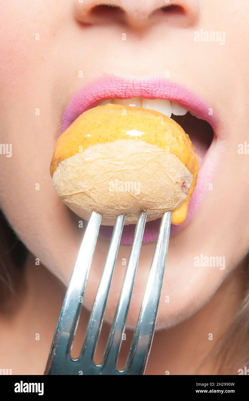 woman's mouth eating with a fork Stock Photo Alamy