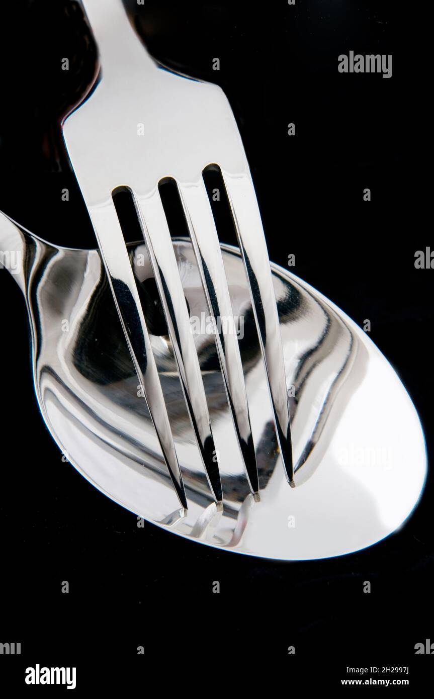 spoon and fork in black background Stock Photo Alamy